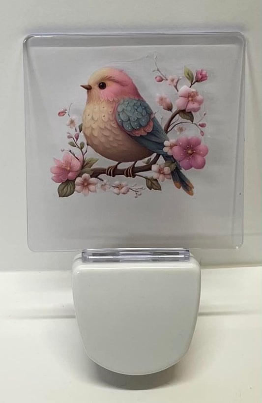 BLUE AND PINK BIRD ON BRANCH